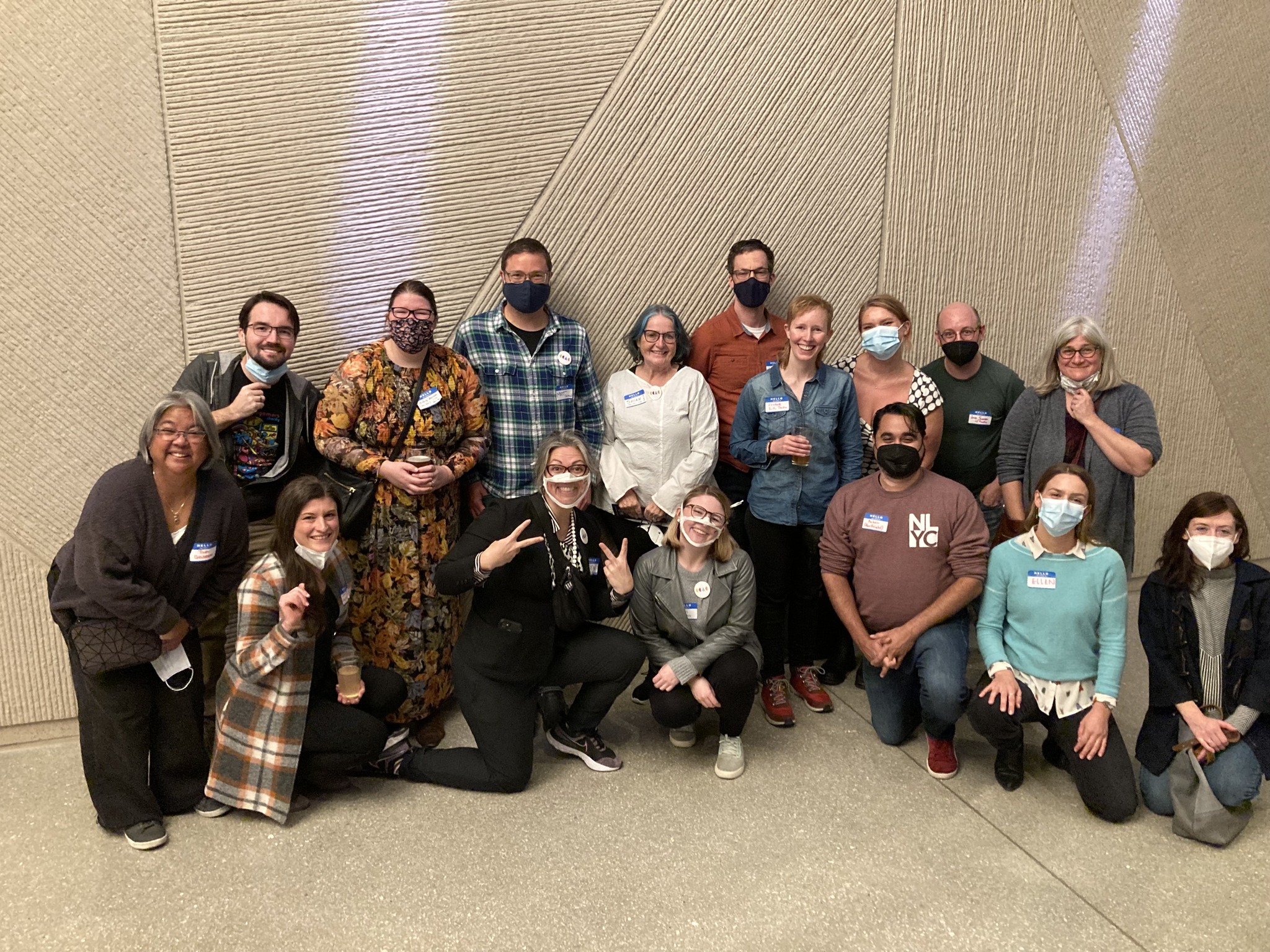 Group Photo. Sixteen attendees gather together and smile for the camera COVID style (with masks) at a Cultural Access Collab event.